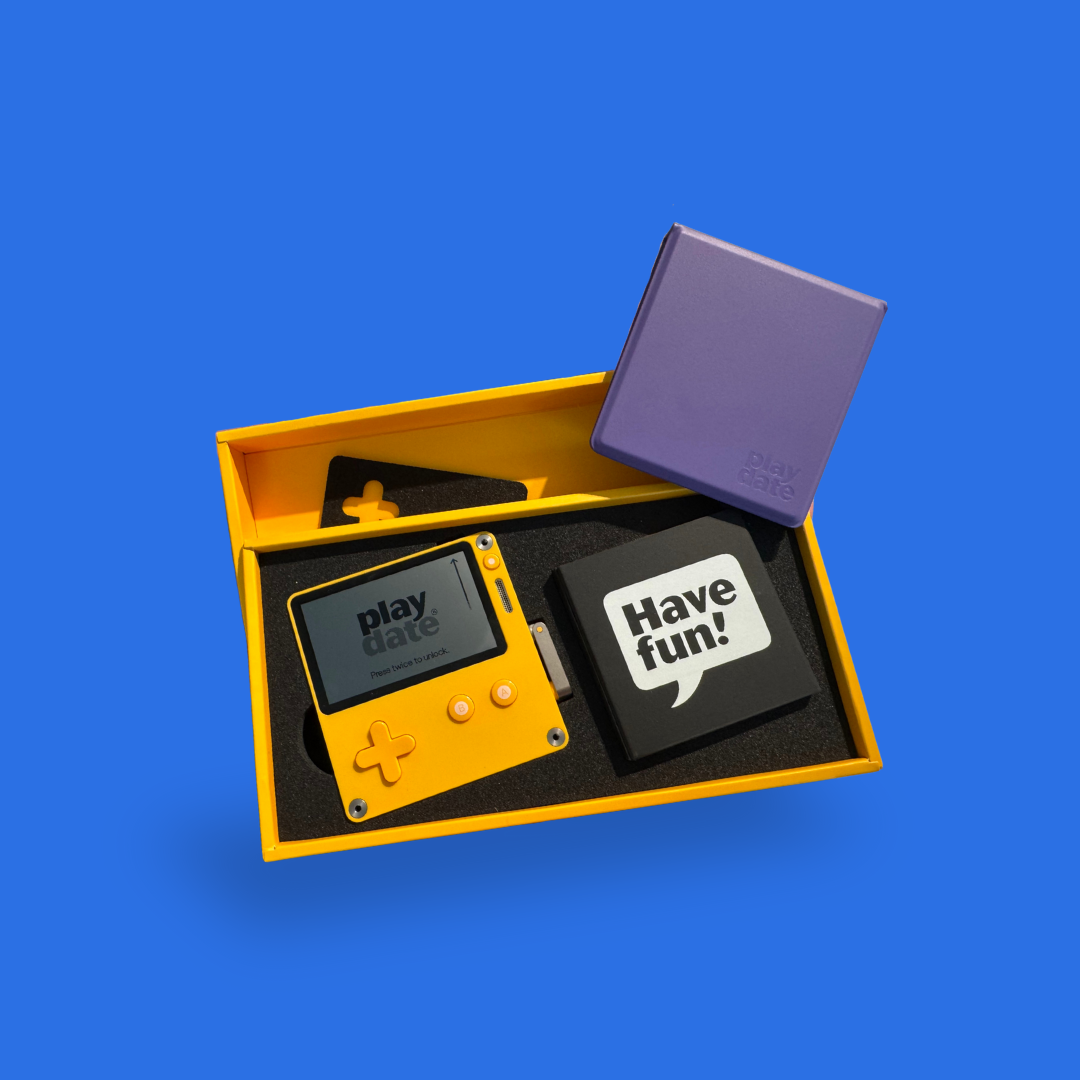 Panic Playdate purple cover in box